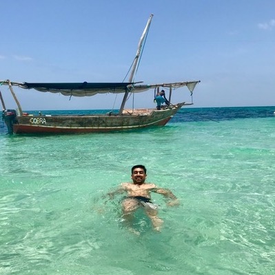 Murtaza and boat in Zanzibar